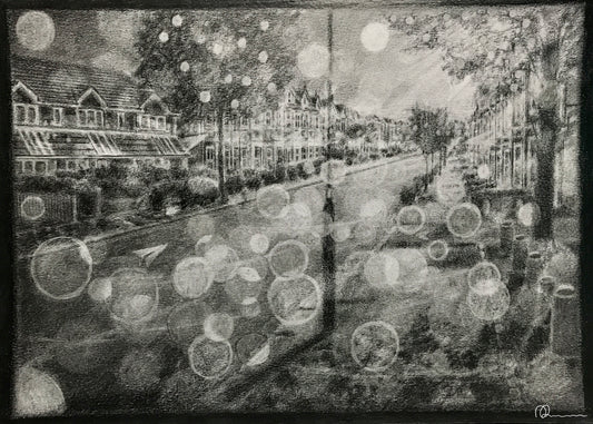 Black and white street scene with blurred lights and reflections