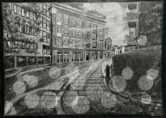 Black and white drawing of a city street with buildings and lights.