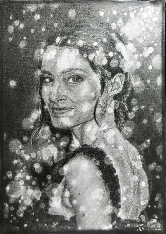 Black and white portrait of a woman with a blurred background